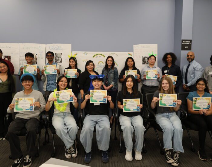 Photo of 12 SMUD interns holding up their True Colors certificate with staff